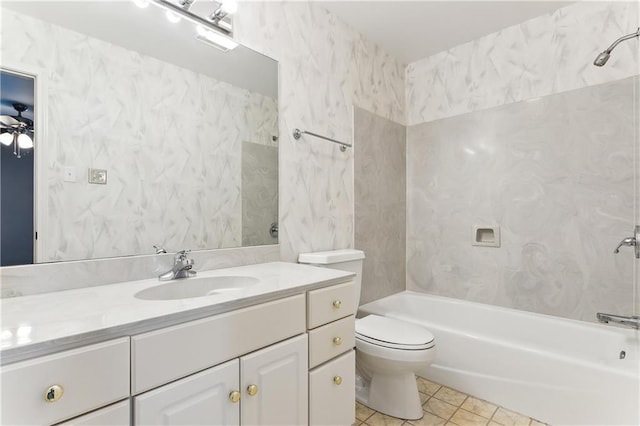 full bathroom featuring tile patterned flooring, vanity, toilet, and tiled shower / bath