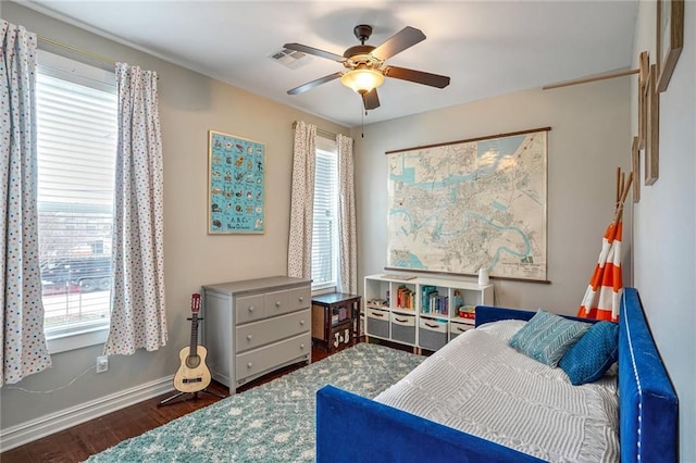 bedroom featuring dark hardwood / wood-style floors and ceiling fan