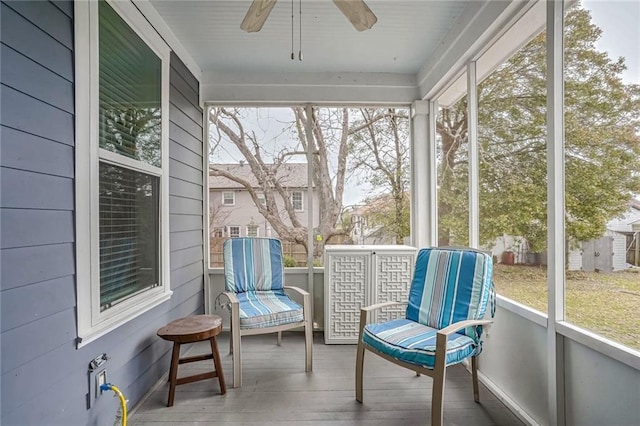 sunroom with plenty of natural light and ceiling fan