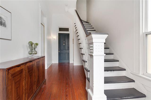 stairs featuring wood-type flooring