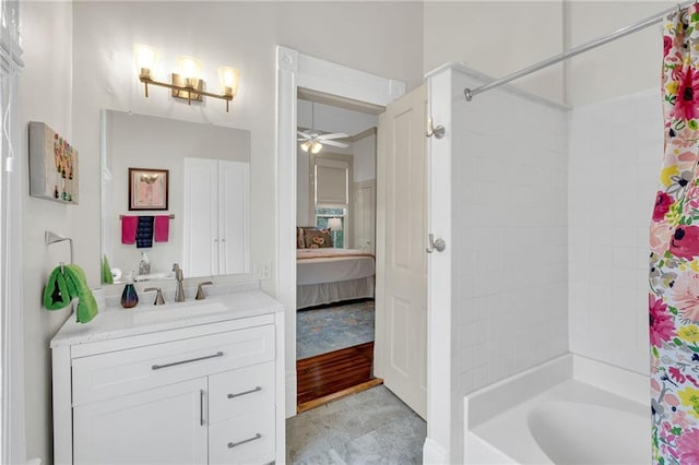 bathroom with shower / bath combination with curtain, ceiling fan, and vanity