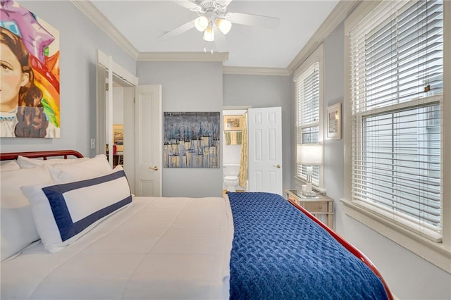 bedroom featuring crown molding, ceiling fan, and ensuite bath