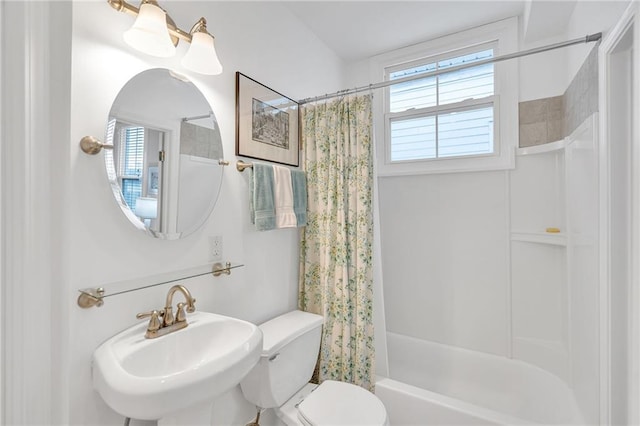 full bathroom with toilet, sink, and shower / bath combo with shower curtain