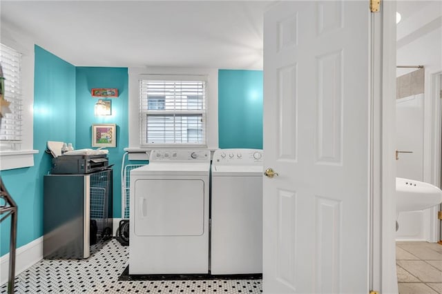 washroom featuring washer and dryer