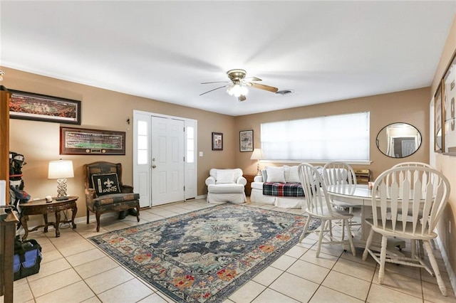 tiled living room featuring ceiling fan