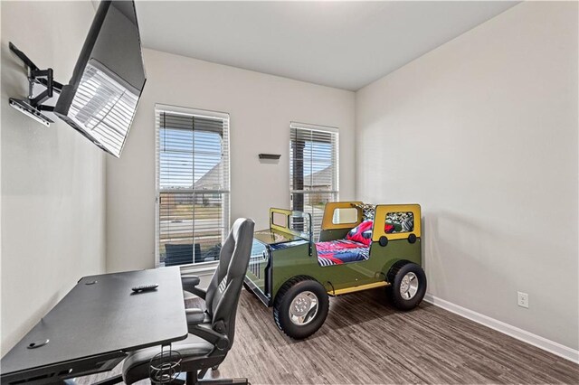 bedroom with wood-type flooring