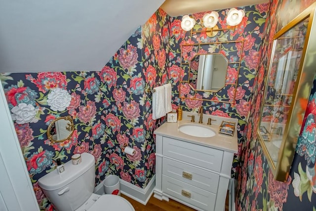 bathroom featuring vanity and toilet