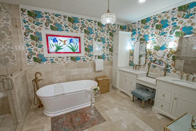 bathroom featuring tile walls, vanity, ornamental molding, and separate shower and tub