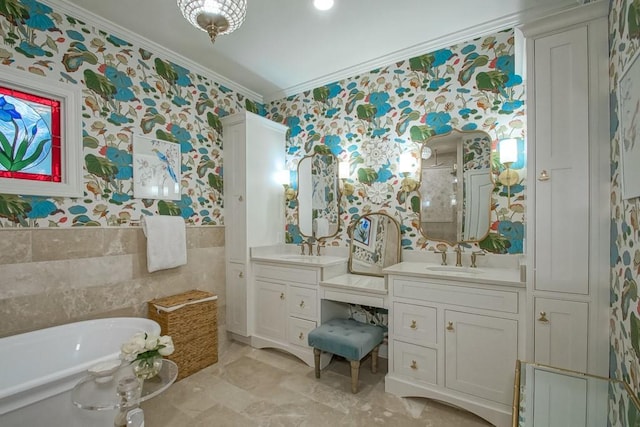 bathroom featuring a tub to relax in, ornamental molding, vanity, and tile walls