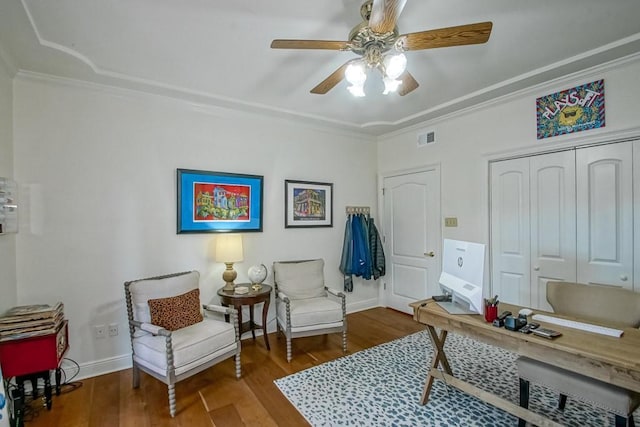 living area featuring crown molding, ceiling fan, and hardwood / wood-style flooring