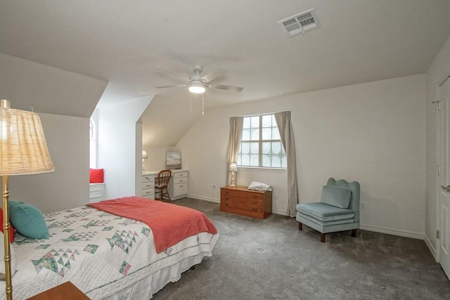 bedroom featuring dark colored carpet, vaulted ceiling, and ceiling fan