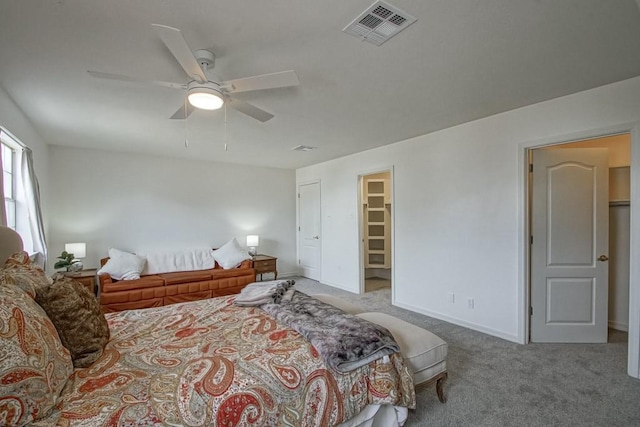 bedroom featuring light colored carpet and ceiling fan