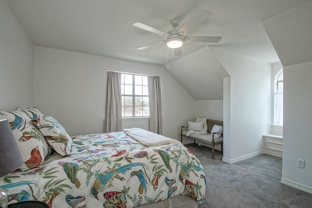 carpeted bedroom with vaulted ceiling and ceiling fan