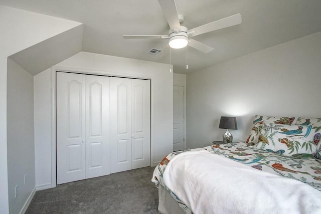 carpeted bedroom featuring ceiling fan and a closet