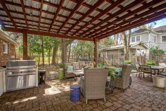 view of patio / terrace with area for grilling, outdoor lounge area, and an outdoor kitchen