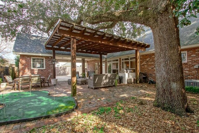 exterior space featuring central AC unit, an outdoor living space, and a pergola