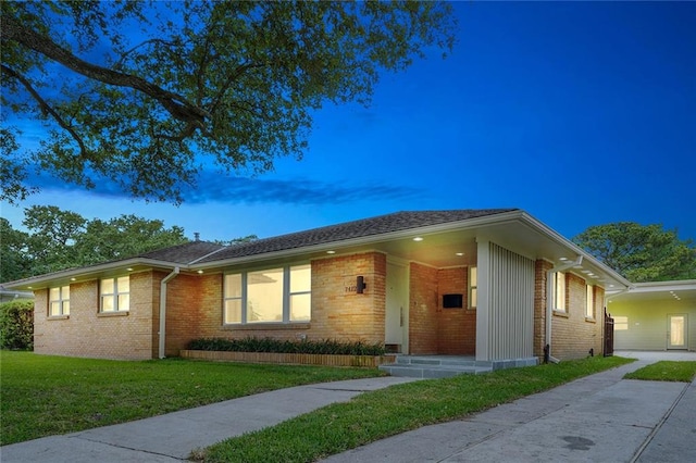 ranch-style house with a yard