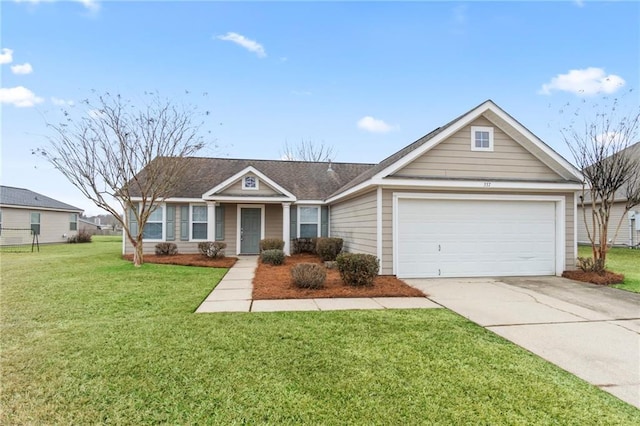 ranch-style house featuring a garage and a front lawn