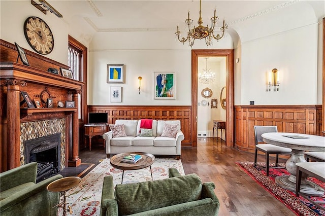 living room featuring an inviting chandelier and dark hardwood / wood-style floors