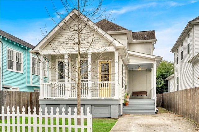 back of property featuring a porch and a lawn