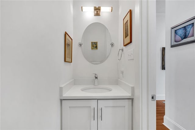 bathroom featuring vanity and hardwood / wood-style floors