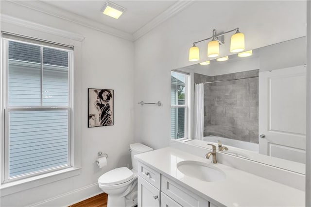 bathroom featuring ornamental molding, toilet, wood-type flooring, and vanity