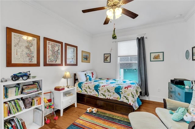 bedroom featuring ceiling fan, ornamental molding, and light hardwood / wood-style floors