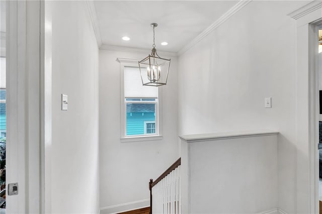 interior space featuring crown molding and a notable chandelier