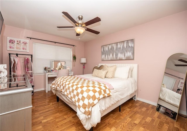 bedroom featuring hardwood / wood-style flooring and ceiling fan