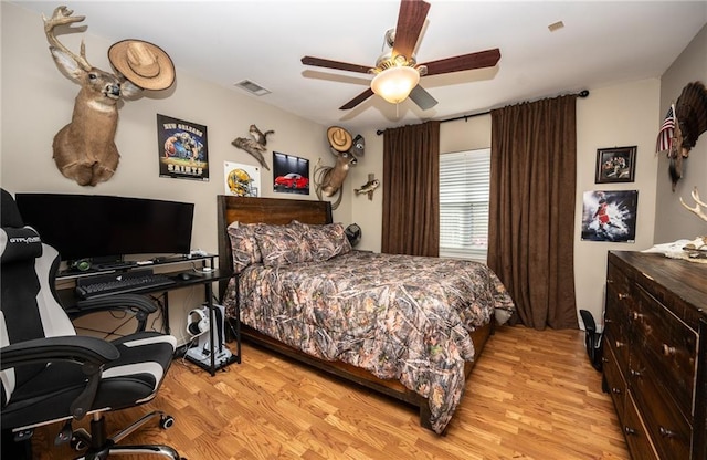 bedroom with ceiling fan and light hardwood / wood-style flooring