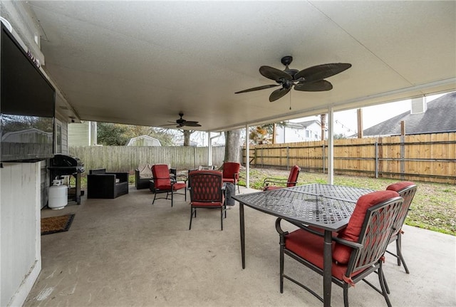 view of patio / terrace featuring ceiling fan and a grill