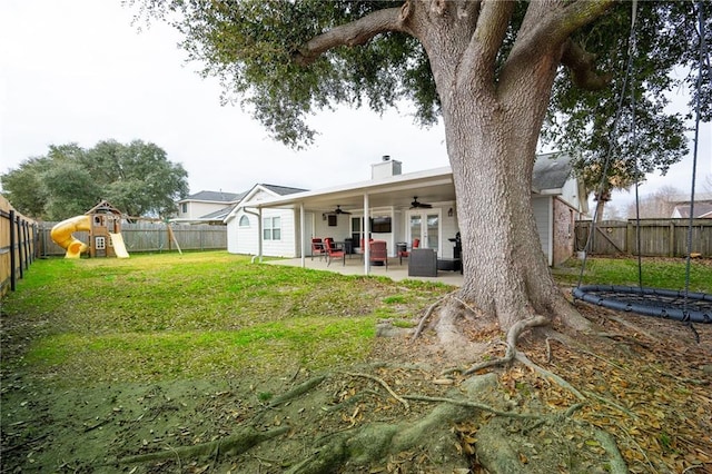 view of yard with a patio area, a trampoline, outdoor lounge area, ceiling fan, and a playground