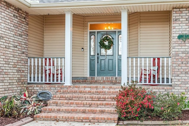 property entrance with covered porch