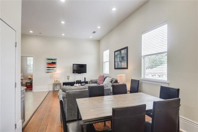 dining space featuring a wealth of natural light and light hardwood / wood-style floors