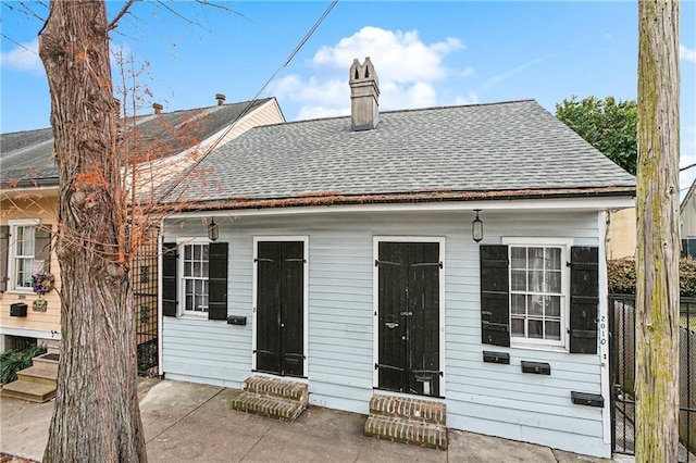 back of house with a patio