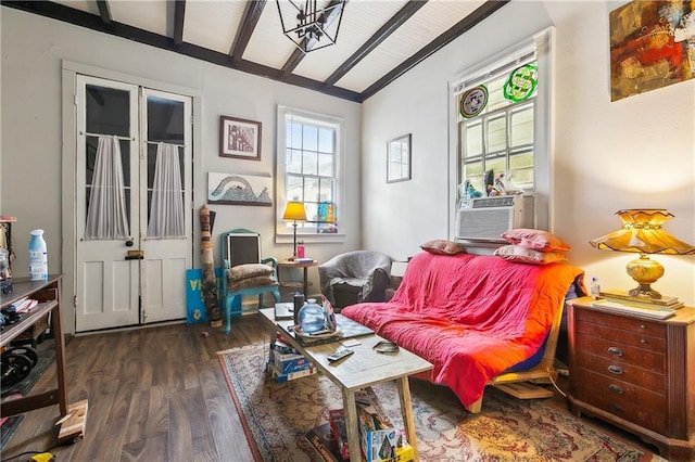 sitting room featuring cooling unit, vaulted ceiling with beams, and dark wood-type flooring