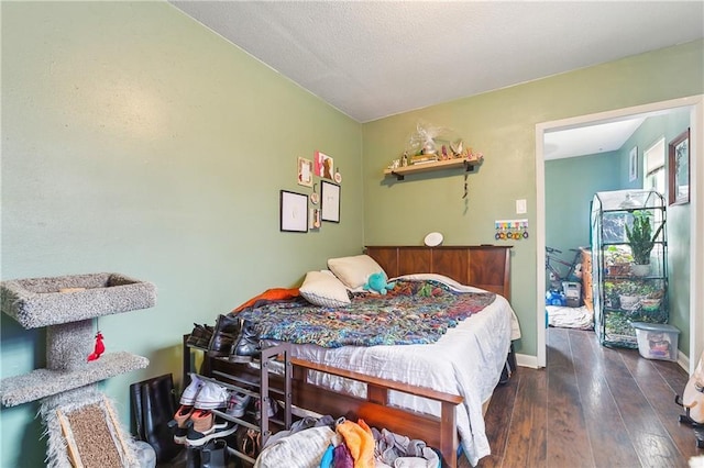 bedroom featuring dark hardwood / wood-style floors