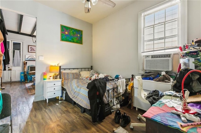 bedroom with dark hardwood / wood-style flooring and cooling unit