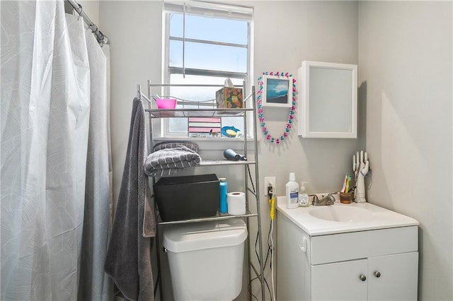 bathroom featuring vanity and toilet