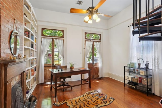 office featuring ceiling fan, hardwood / wood-style floors, and a wealth of natural light