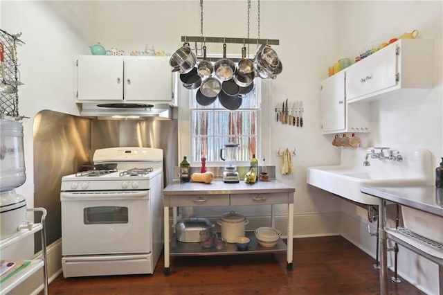 kitchen featuring white cabinetry, white gas stove, and dark hardwood / wood-style flooring