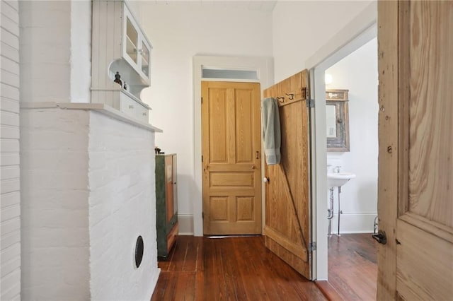 hall with dark hardwood / wood-style flooring