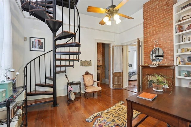 interior space featuring hardwood / wood-style flooring and ceiling fan