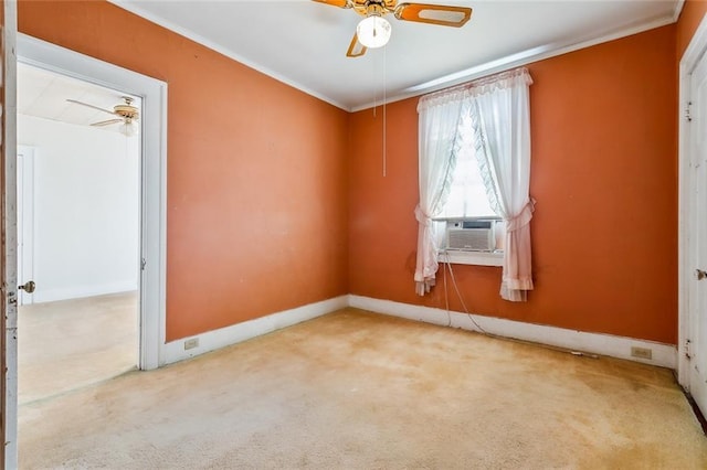 unfurnished room with ceiling fan, cooling unit, carpet floors, baseboards, and crown molding