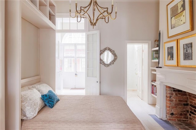 bedroom with connected bathroom and a notable chandelier