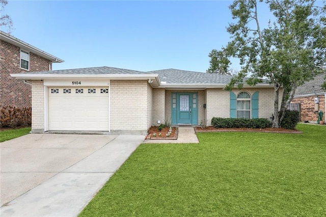 single story home with a garage and a front yard