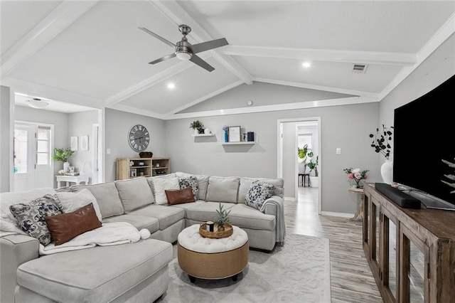 living room with lofted ceiling with beams, ceiling fan, and light hardwood / wood-style floors