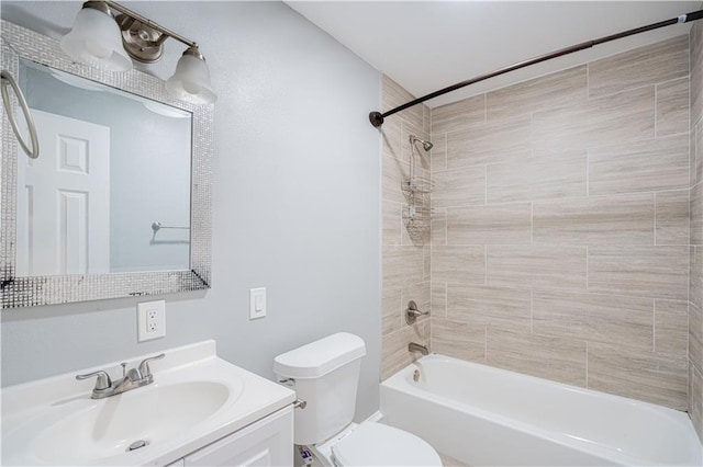 full bathroom featuring vanity, toilet, and tiled shower / bath combo