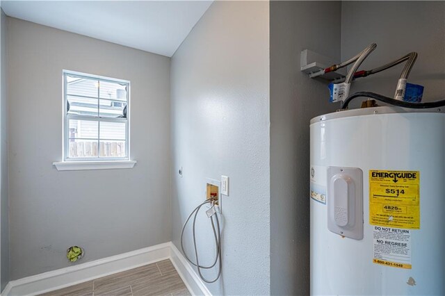 washroom with hardwood / wood-style flooring, hookup for a washing machine, and water heater