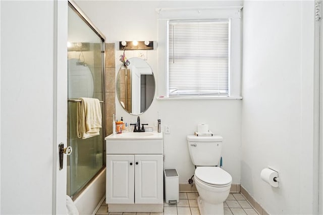 full bathroom with vanity, toilet, tile patterned flooring, and combined bath / shower with glass door